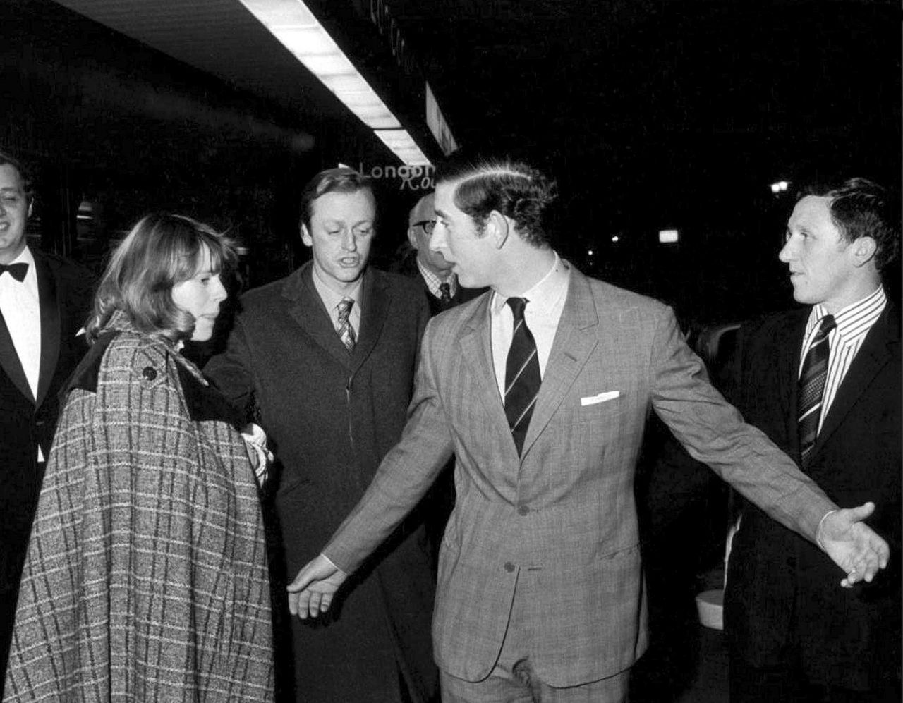 Camilla and her husband, Andrew, leave the Royal Opera House with Prince Charles in February 1975. Camilla and Charles reportedly met at a polo match in 1970 and became friends.