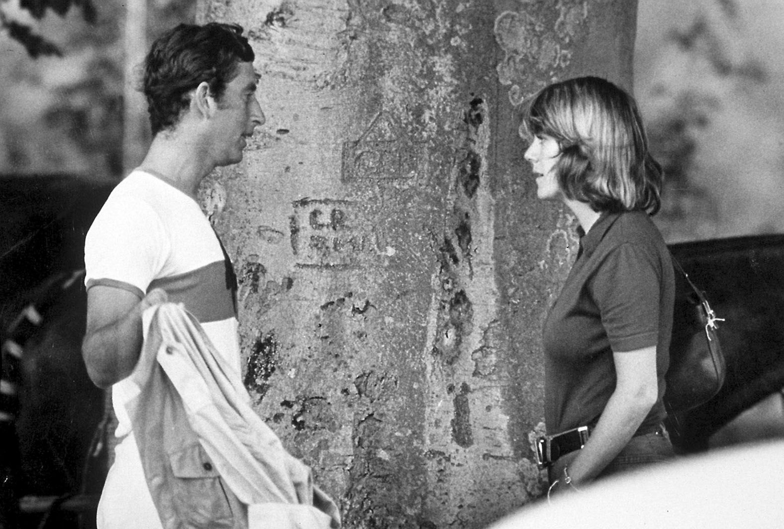 Camilla talks to Prince Charles at a polo match  in 1975.