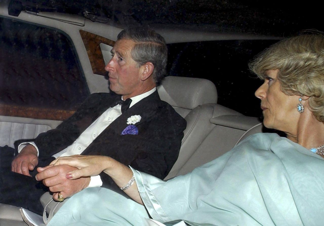 Charles and Camilla leave a charity event together in July 2002.