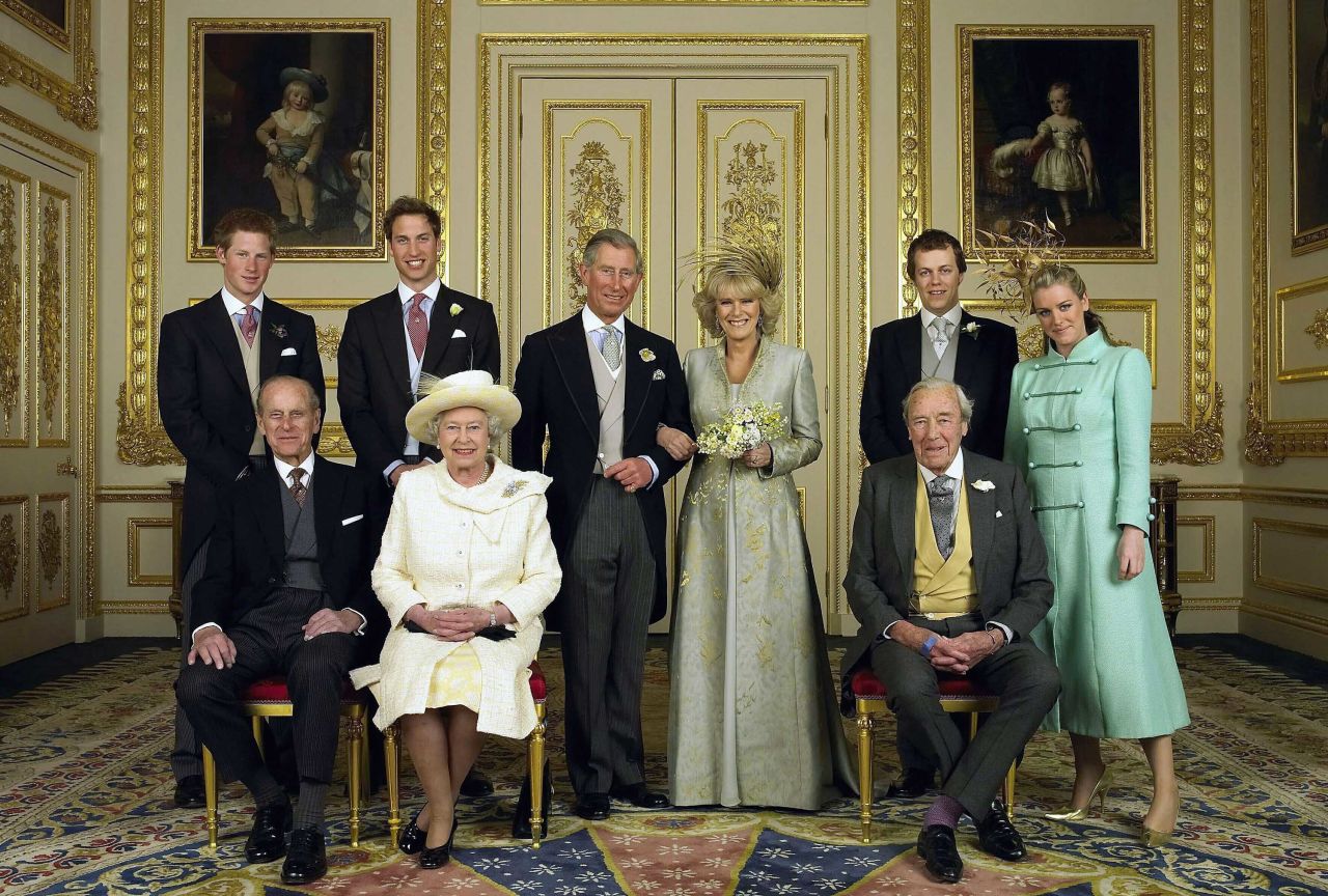 Camilla and Charles pose for a wedding photo with their children and parents in April 2005. On the left are Charles' sons Prince Harry and Prince William and his parents, Prince Philip and Queen Elizabeth II. On the right are Camilla's children Laura and Tom and her father, Bruce.