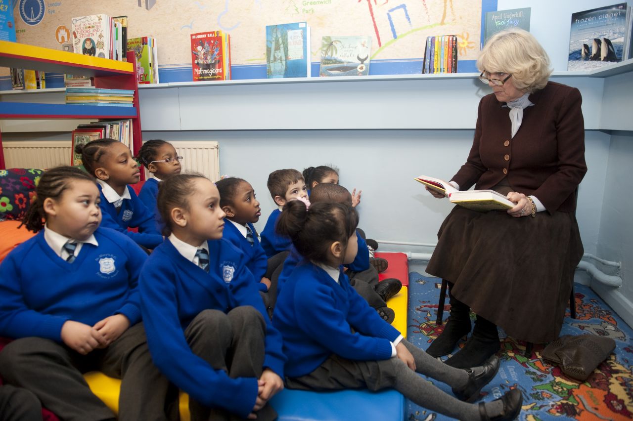 Camilla reads to primary school students in London in January 2012.