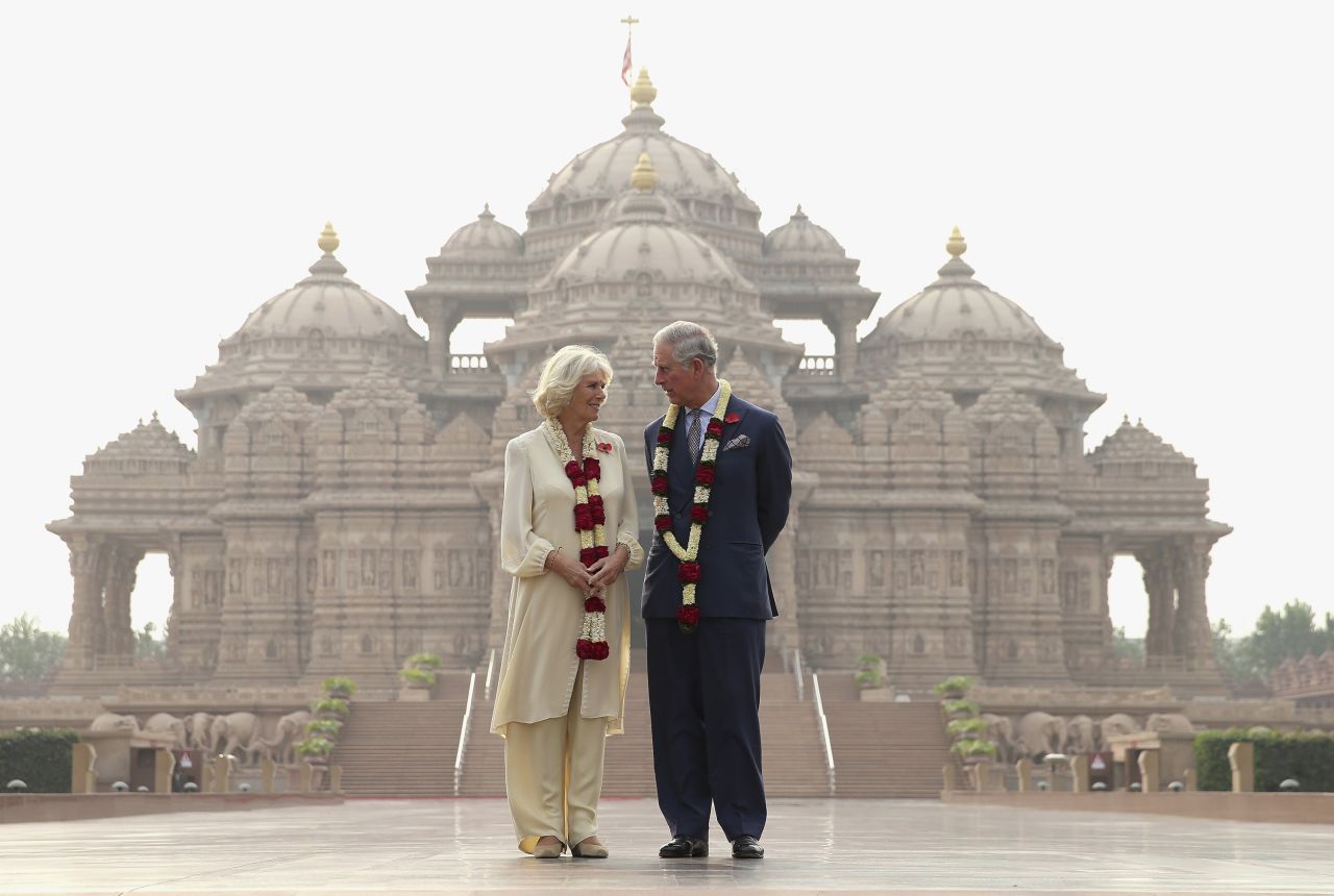 Charles and Camilla pose outside the Akshardham Temple while visiting New Delhi in November 2013.