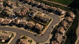 An aerial image taken on February 8, 2023 shows a neighborhood of homes in the wildland-urban interface near Chino Hills State Park in Chino Hills, California. 