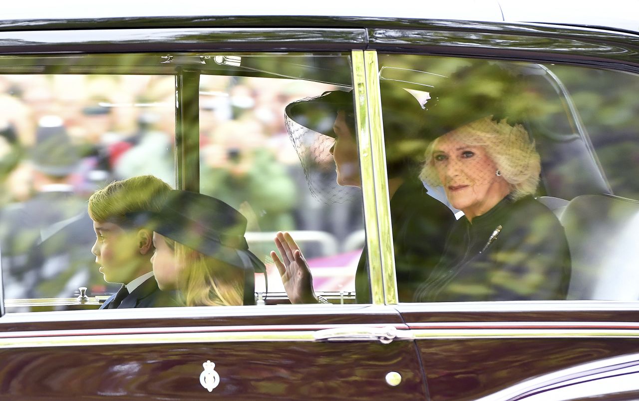 Camilla rides in a car with Catherine, Prince George and Princess Charlotte ahead of the Queen's state funeral in September 2022.