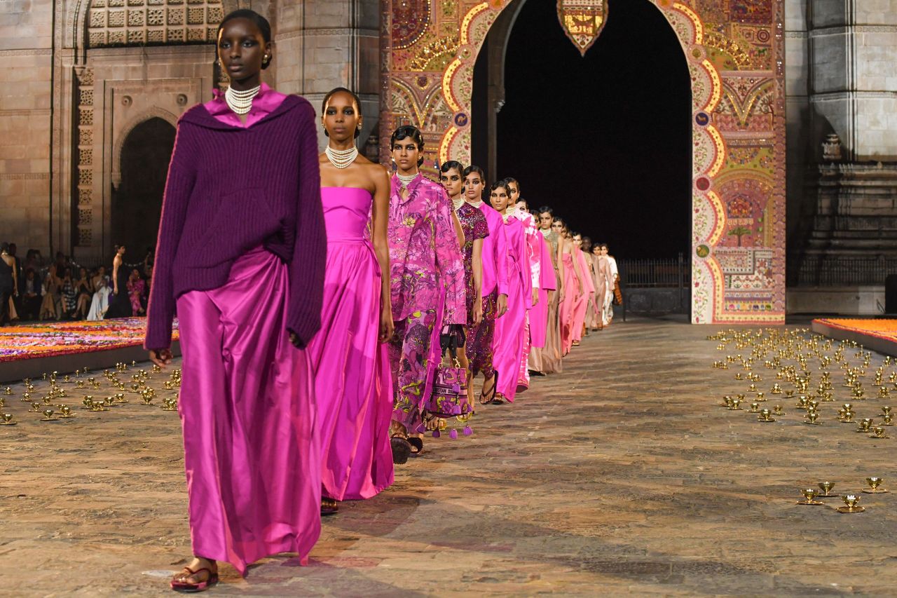 The collection featured looks in bold, vibrant colors — pinks, purples, rich blues and chartreuse yellows.