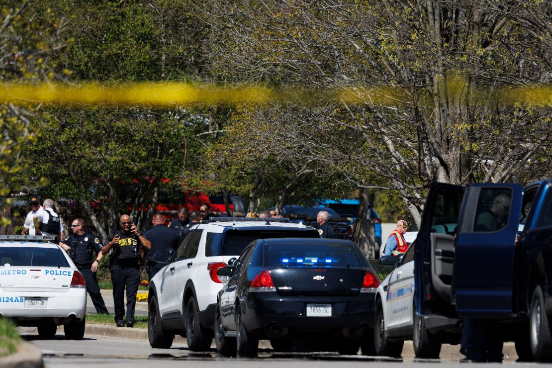  Police work near the scene of the mass shooting at The Covenant School in Nashville on Monday.