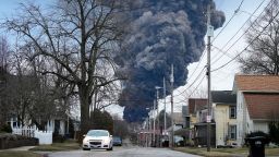 FILE - A black plume rises over East Palestine, Ohio, as a result of a controlled detonation of a portion of the derailed Norfolk Southern trains Monday, Feb. 6, 2023. On Friday, Feb. 17, The Associated Press reported on stories circulating online incorrectly claiming a video of a purple cloud looming over a street as a car drives underneath shows East Palestine, Ohio, after a recent freight train derailment and intentional burning of some of the hazardous chemicals on board.(AP Photo/Gene J. Puskar, File)