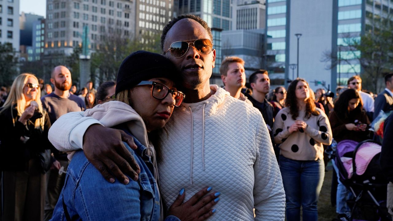 People attend a vigil after a deadly school shooting at the Covenant School in Nashville on Wednesday.