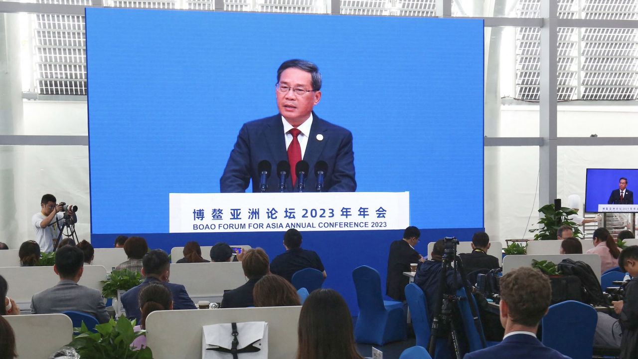 Journalists watch a screen showing China's Premier Li Qiang delivering a speech during the opening of the Boao Forum for Asia in Boao, south China's Hainan province on March 30, 2023. (Photo by AFP) / China OUT (Photo by STR/AFP via Getty Images)