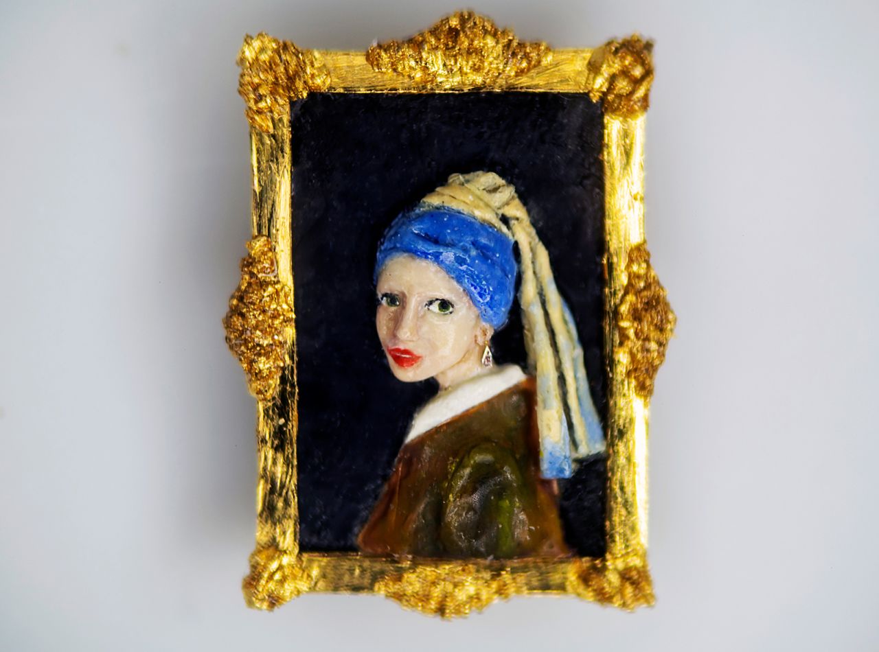 A microscopic sculture of famous Dutch artist Johannes Vermeer's "Girl With A Pearl Earring" painting.