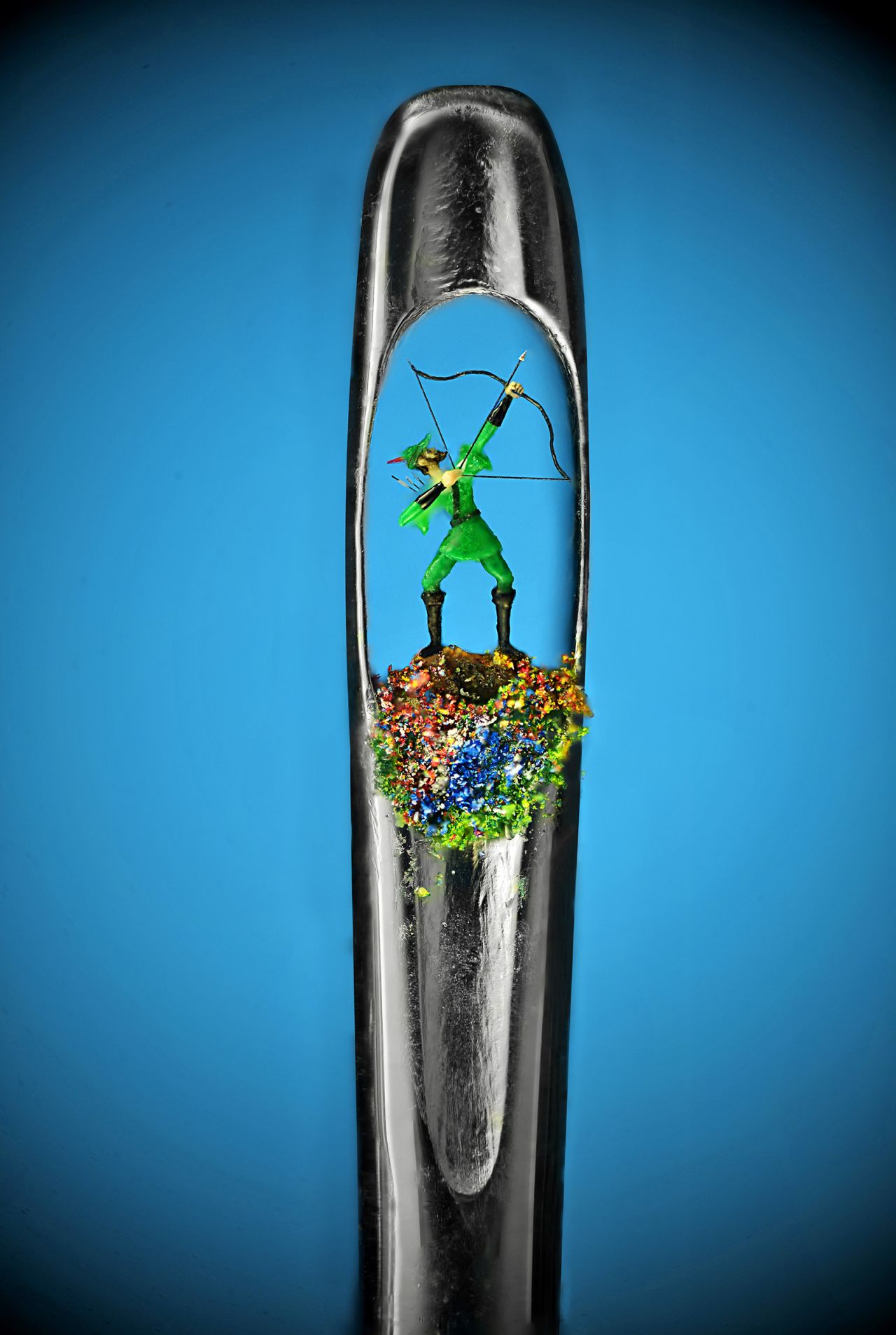 This tiny artwork depicts the character Robin Hood.