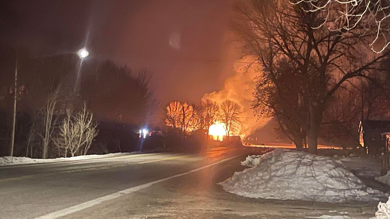 Brittney Phelps, who lives near the derailment site, took this photo of a fire burning from the wreckage.