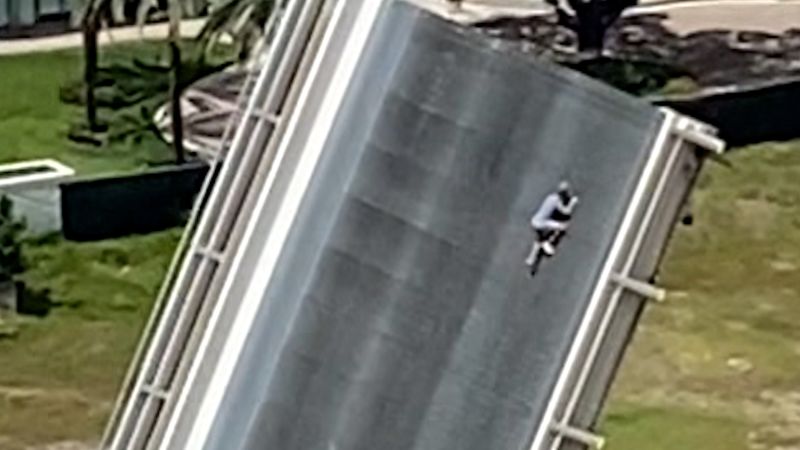 NextImg:Video: Florida drawbridge climber goes viral after daring ascent | CNN