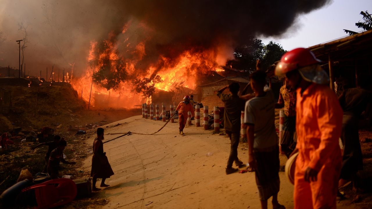 Rohingya refugees try to douse a major fire in their Balukhali camp at Ukhiya in Cox's Bazar district of Bangladesh on Sunday, March 5.