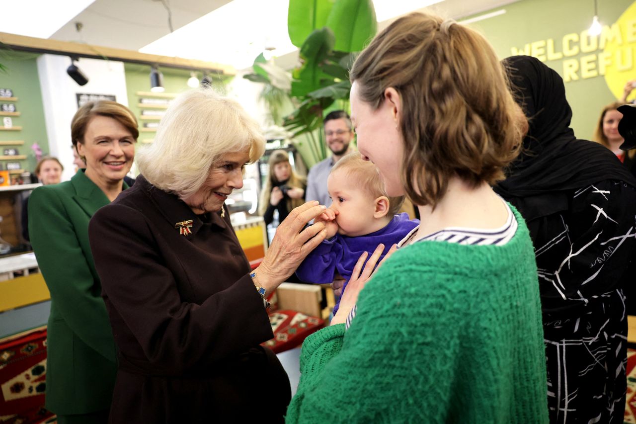 The Queen Consort visits Refugio Berlin and speaks with Diana Strassheim and baby Kuno on Thursday.