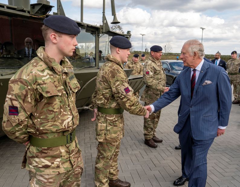 The King greets soldiers during his visit to the Joint Military Unit at Finowfurt, Germany, on Thursday.