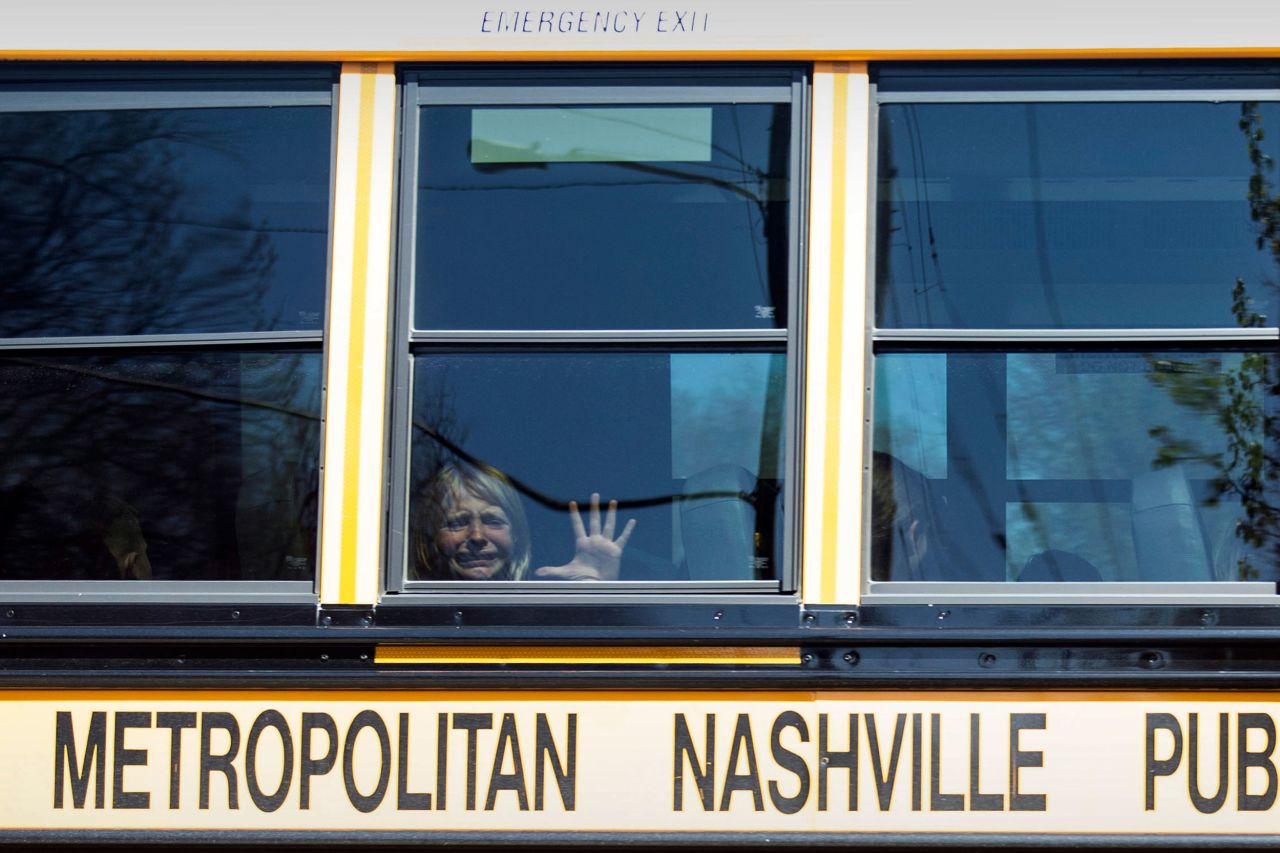A child cries on a bus leaving The Covenant School after a deadly shooting at the school in Nashville on Monday, March 27.