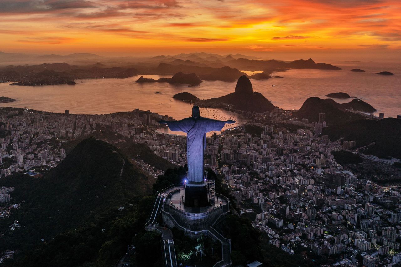 The sun rises in front of the Christ the Redeemer statue in Rio de Janeiro on Wednesday, March 29.