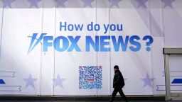 A person walks past the Fox News Headquarters at the News Corporation building in New York City on March 9, 2023. - Dominion Voting Systems is suing Fox News and parent company Fox Corp. over election fraud claims.