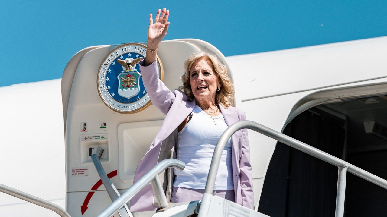 First Lady Jill Biden waves before entering the plane on her departure to Kenya from the Hosea Kutako International Airport in Windhoek on February 24, 2023.