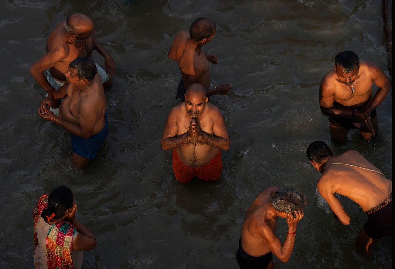 Hindu devotees pray in the Sarayu River in Ayodhya, India, on Thursday, March 30. It was for the Rama Navami festival that celebrates the birthday of the Hindu God Rama.