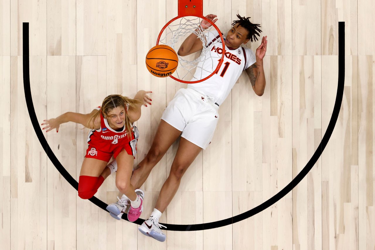 Ohio State's Jacy Sheldon, left, watches her shot after colliding with Virginia Tech's D'asia Gregg during an NCAA Tournament game on Monday, March 27.