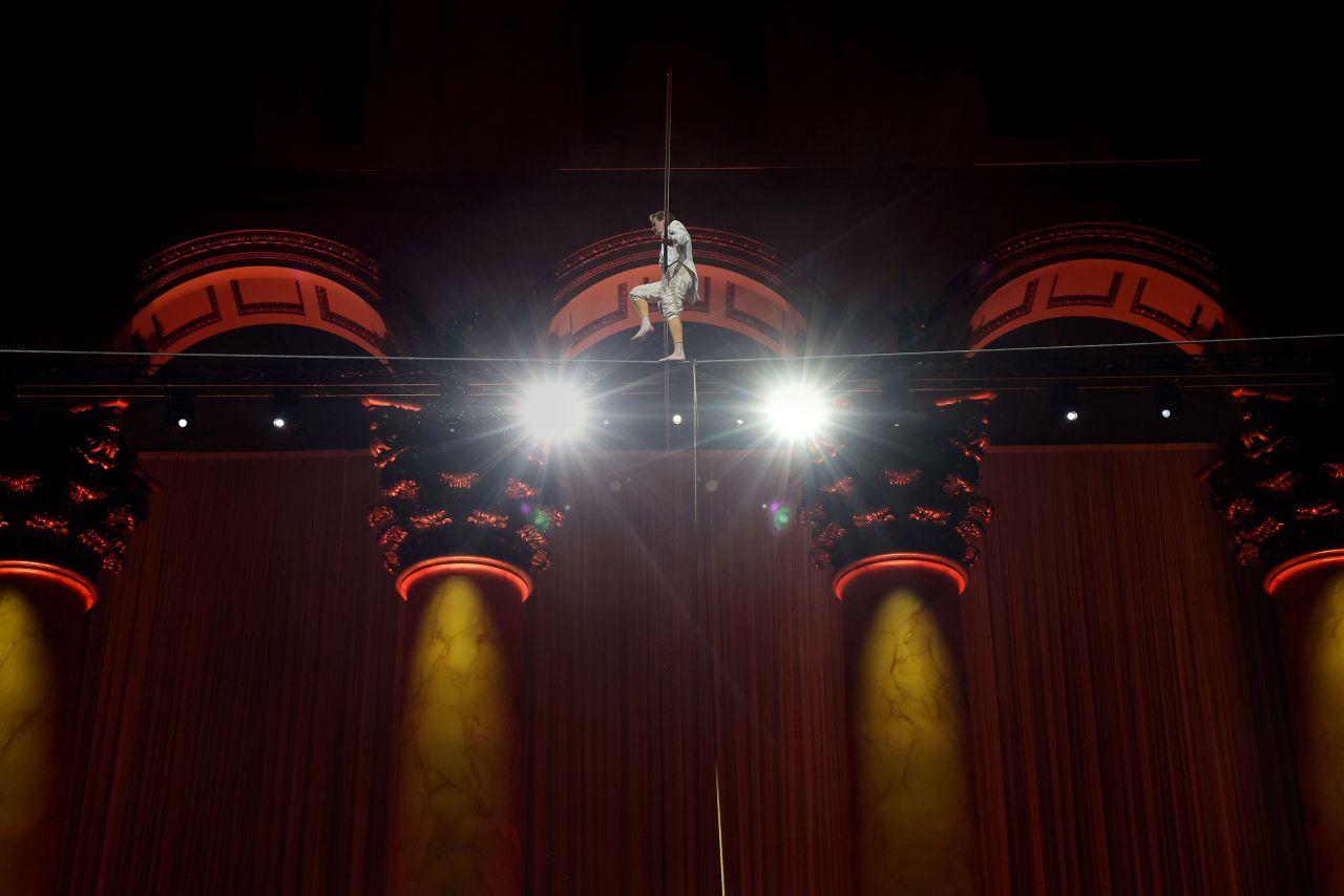 French high-wire artist Philippe Petit performs above the Great Hall at the National Building Museum in Washington, DC, on Thursday, March 23.