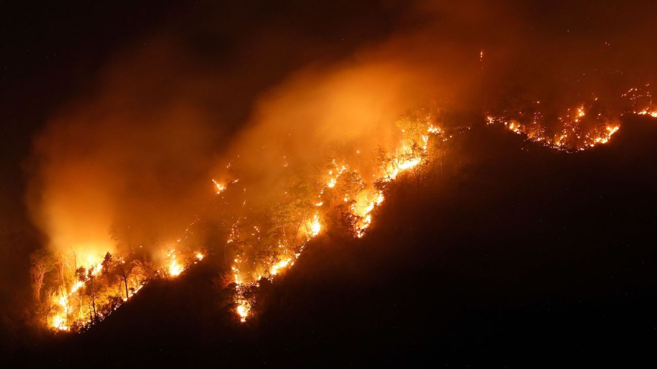 A forest fire rages in Nakhon Nayok province, northeast of Bangkok, on March 30, 2023.