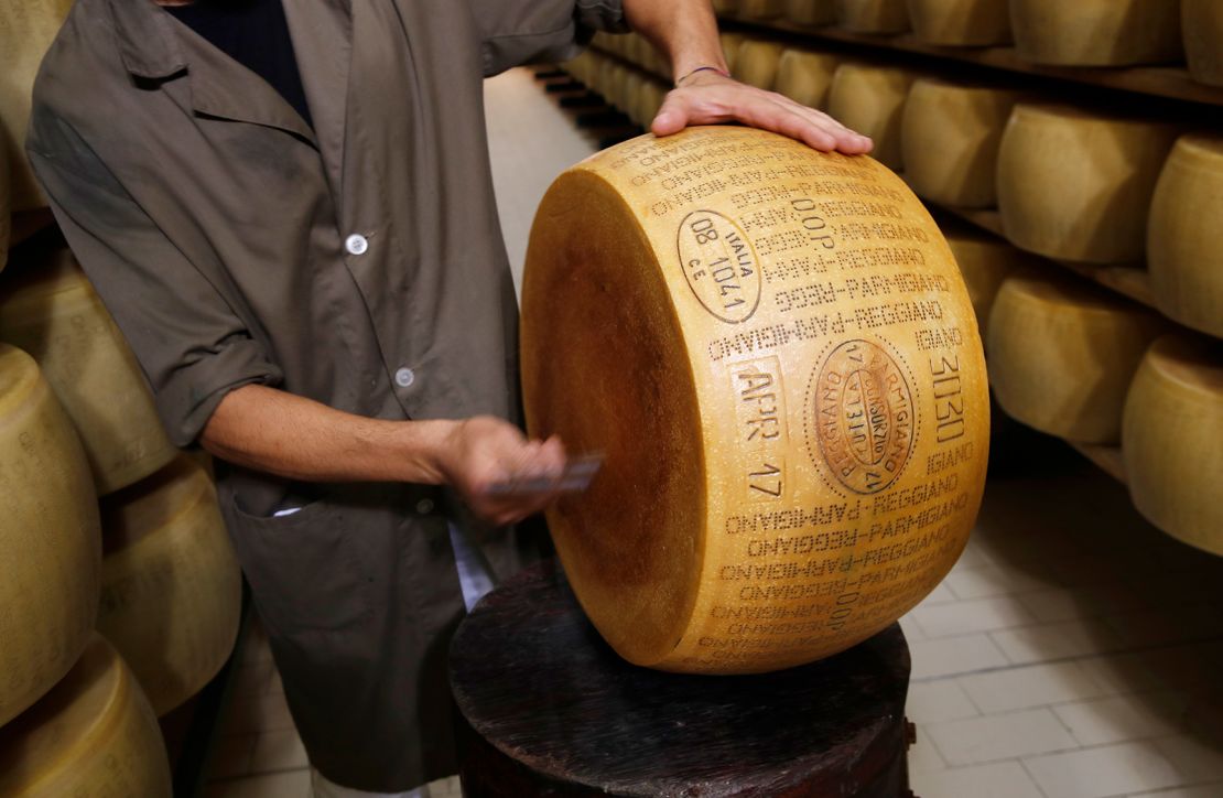 A quality control inspection on Parmigiano Reggiano Parmesan cheese.