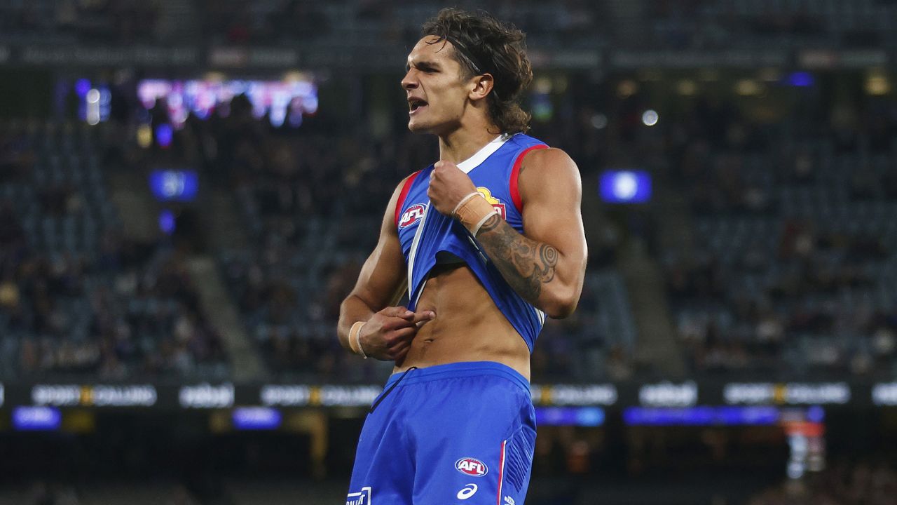 MELBOURNE, AUSTRALIA - MARCH 30: Jamarra Ugle-Hagan of the Bulldogs points to his skin as he celebrates kicking a goal during the round three AFL match between Western Bulldogs and Brisbane Lions at Marvel Stadium, on March 30, 2023, in Melbourne, Australia. (Photo by Daniel Pockett/Getty Images)