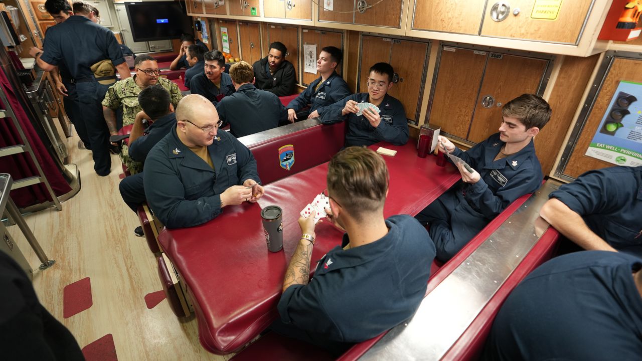 Sailors socialize on board USS Mississippi on March 29.