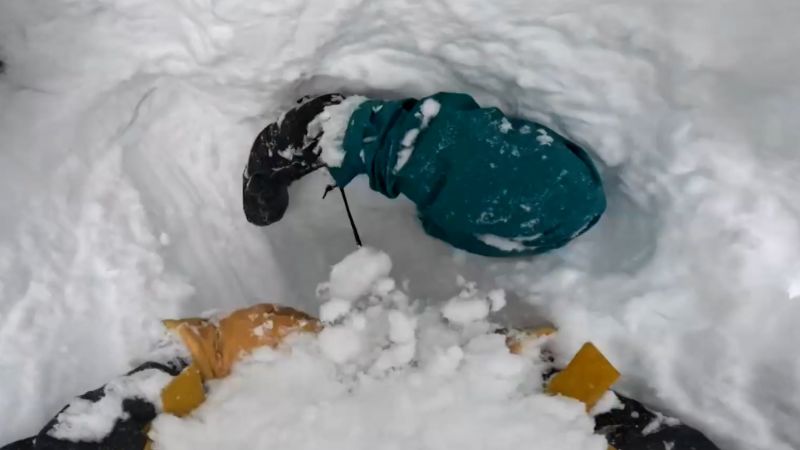 A snowboarder got buried upside down in snow. See skier’s quick reaction.