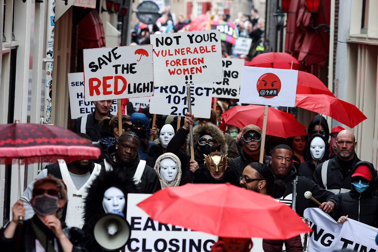 Sex workers and sympathisers take part in a demonstration to protest plans to shutter the city's historic red-light district.