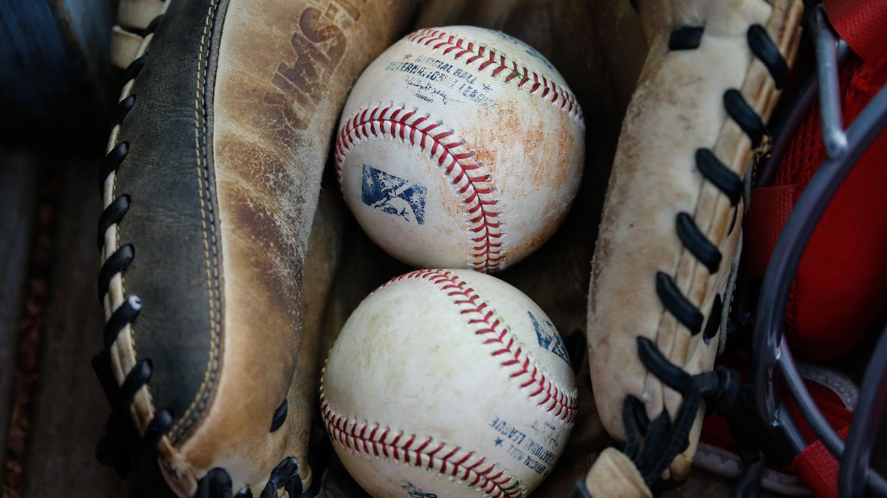 A general view of baseballs resting in a catcher's glove is seen during a regular season game between the Louisville Bats and the Toledo Mud Hens on July 30, 2019 at Fifth Third Field in Toledo, Ohio. 
