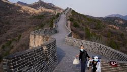 BEIJING, CHINA - MARCH 24:  Chinese tourists wearing protective face masks visit the Badaling Great Wall after it was re-opened on March 24, 2020 in Beijing, China. The Badaling Great Wall has been closed since January 25, 2020, after the coronavirus (Covid-19) outbreak started, but re-opened on March 24 to a limited number of tourists who passed certain health criteria.  (Photo by Lintao Zhang/Getty Images)