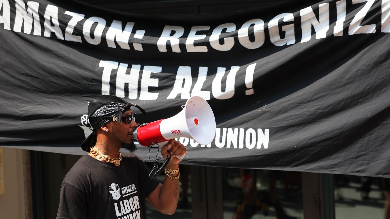 Christian Smalls, President of the ALU, speaks as Pro-union protestors gather for a rally near the home of Amazon CEO Jeff Bezos on Fifth Avenue on September 05, 2022 in New York City. Members of the Amazon Labor Union (ALU) led by Christian Smalls, President of the ALU, and Amazon workers were joined by Starbucks workers, community organizations and pro-union protestors for a Labor Day March for Recognition demanding their unions be recognized by Amazon and Starbucks. The protestors gathered at the NYC homes Bezos and Starbucks' interim CEO Howard Schultz before holding a rally in Times Square. 