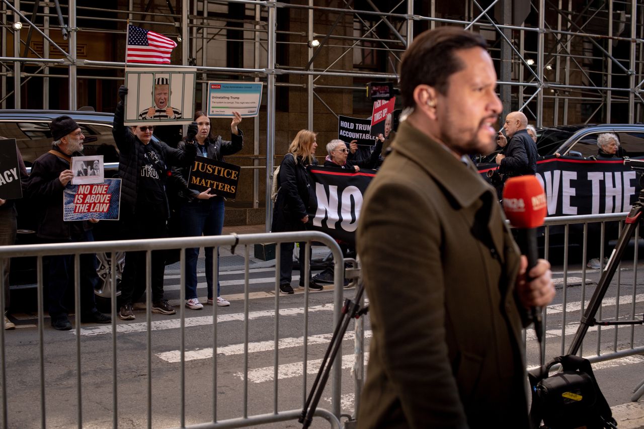 Reporters and demonstrators were posted outside Trump Tower in Manhattan after news broke of Trump's indictment on Thursday, March 30.