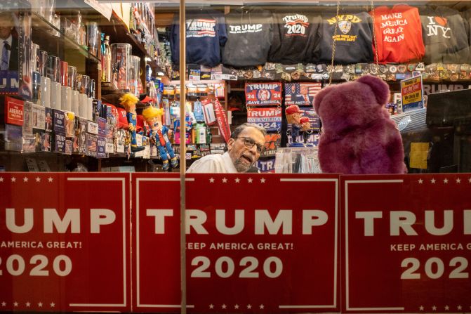 An employee is seen behind the counter at the Trump Tower gift shop in New York on March 21, 2023.