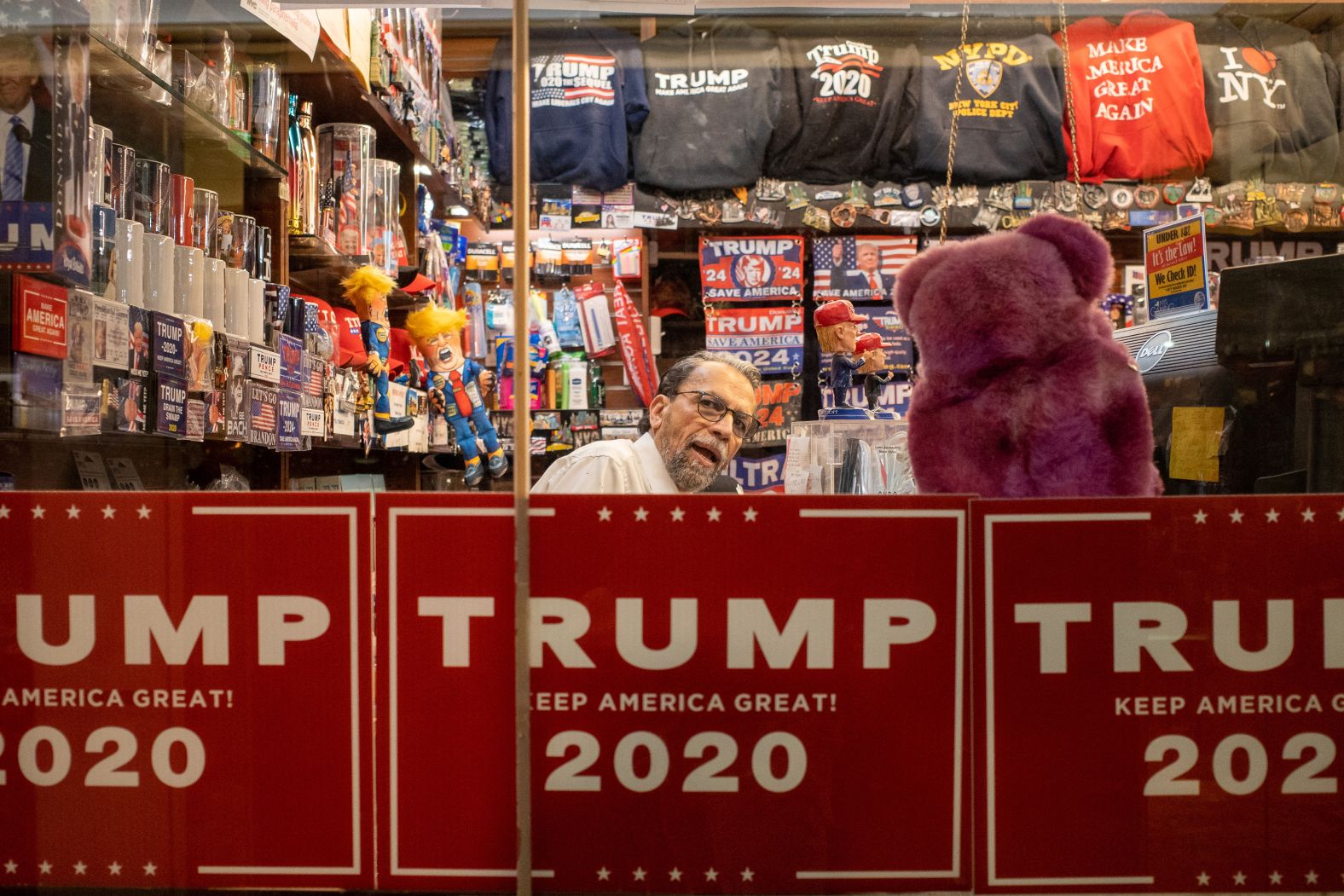 An employee is seen behind the counter at the Trump Tower gift shop in New York on March 21.