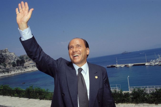 Berlusconi waves while attending a European Council meeting in Corfu, Greece, in June 1994.