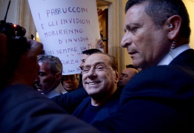 Berlusconi smiles as he arrives at his home in Rome in 2015. Italy's top court had just cleared him of charges that he paid for sex with an underage dancer and then abused his position as prime minister to cover it up.