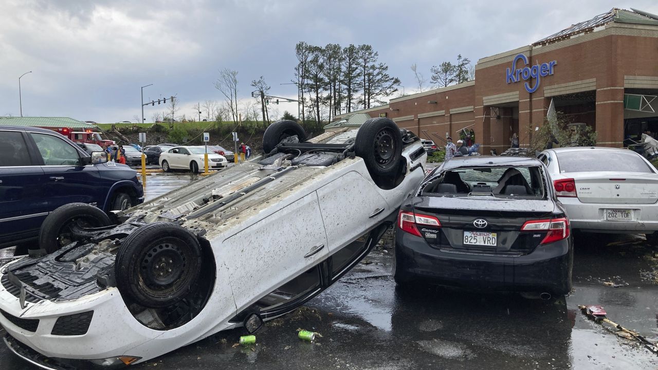 A car is overturned in a Kroger parking lot after a storm swept through Little Rock, Arkansas, on March 31, 2023.