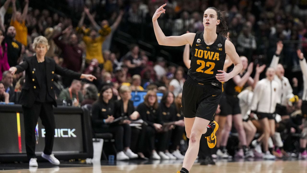 Mar 31, 2023; Dallas, TX, USA; Iowa Hawkeyes guard Caitlin Clark (22) reacts to making a three-point basket against the South Carolina Gamecocks in the second half in semifinals of the women's Final Four of the 2023 NCAA Tournament at American Airlines Center. Mandatory Credit: Kirby Lee-USA TODAY Sports
