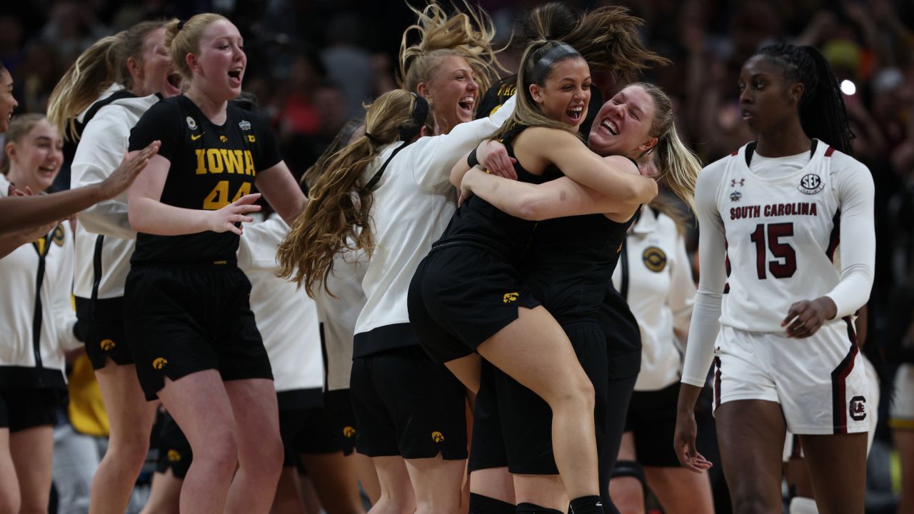 The Iowa Hawkeyes celebrate after their victory.