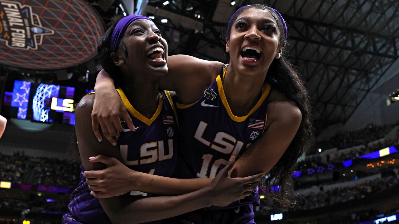 Angel Reese and Flau'jae Johnson  of the LSU Lady Tigers react after ttheir win in the Final Four semifinal game at American Airlines Center on March 31, 2023 in Dallas, Texas.