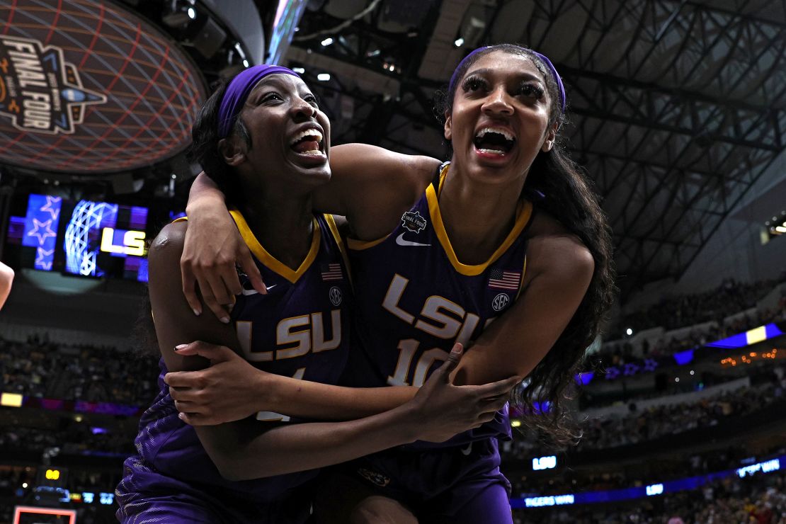 Angel Reese and Flau'jae Johnson  of the LSU Lady Tigers react after ttheir win in the Final Four semifinal game at American Airlines Center on March 31, 2023 in Dallas, Texas.