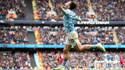 Jack Grealish of Manchester City celebrates after scoring the team's fourth goal during the Premier League match between Manchester City and Liverpool FC at Etihad Stadium on April 01, 2023 in Manchester, England. 
