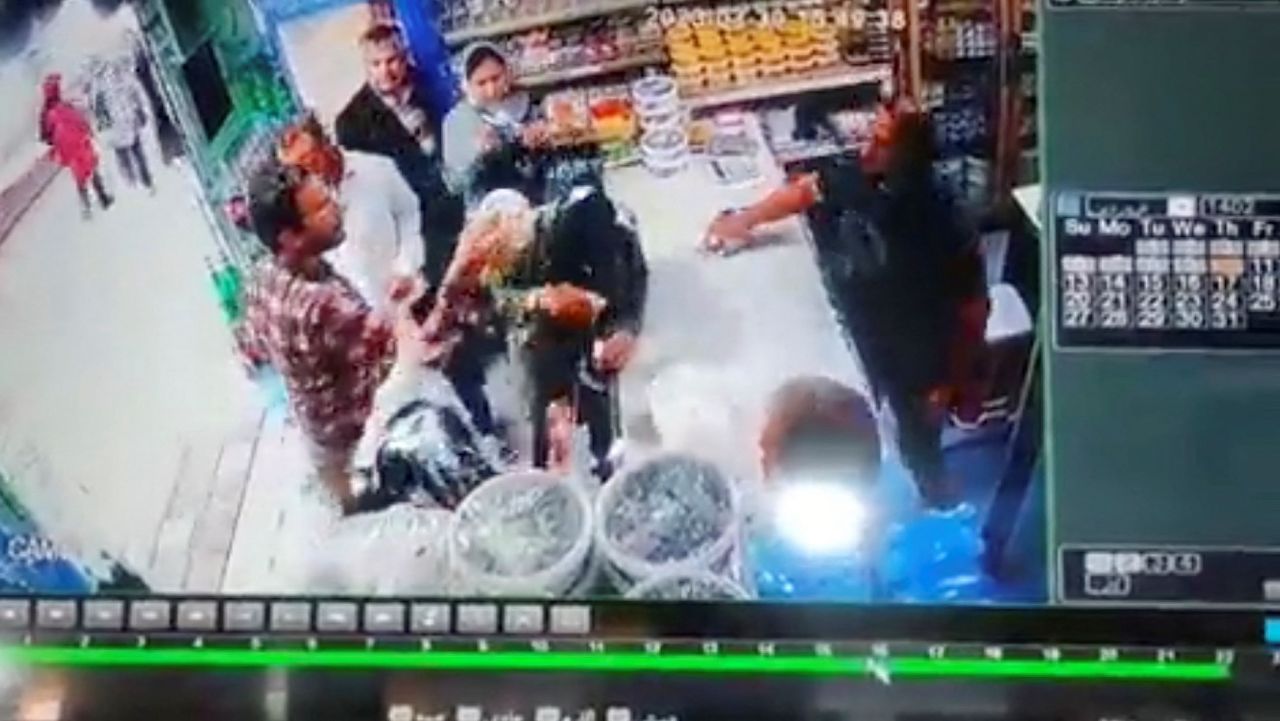 A screen grab of a handout video obtained from social media shows what appears to be a man throwing yogurt at two unveiled women in a shop near a holy Shi'ite Muslim city, Iran. Handout via WANA/via REUTERS  THIS IMAGE HAS BEEN SUPPLIED BY A THIRD PARTY. MANDATORY CREDIT. NO RESALES. NO ARCHIVES. REUTERS IS UNABLE TO INDEPENDENTLY VERIFY THIS IMAGE. IRAN OUT. NO COMMERCIAL OR EDITORIAL SALES IN IRAN. 