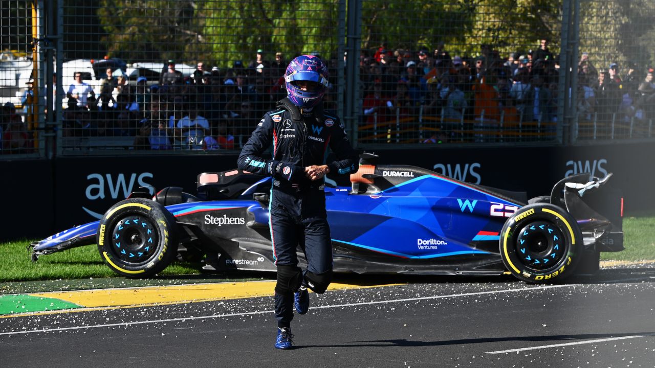 Alexander Albon walks from his car after a crash that led to a red flag. 