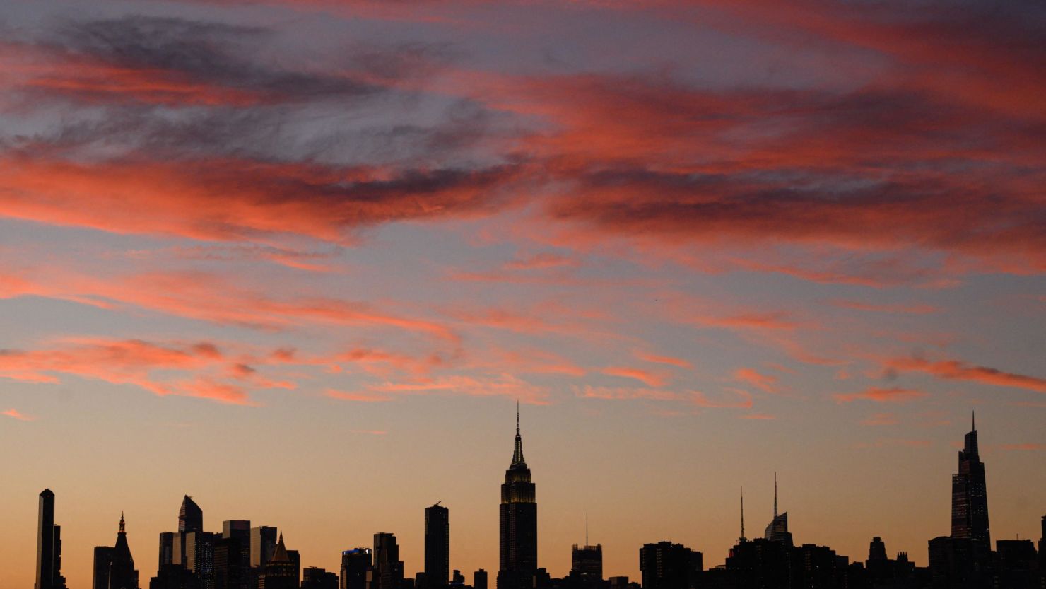 The Manhattan city skyline during sunset in Brooklyn, New York on June 27, 2022.